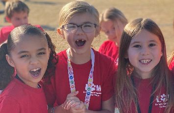  students at field day in red tshirts